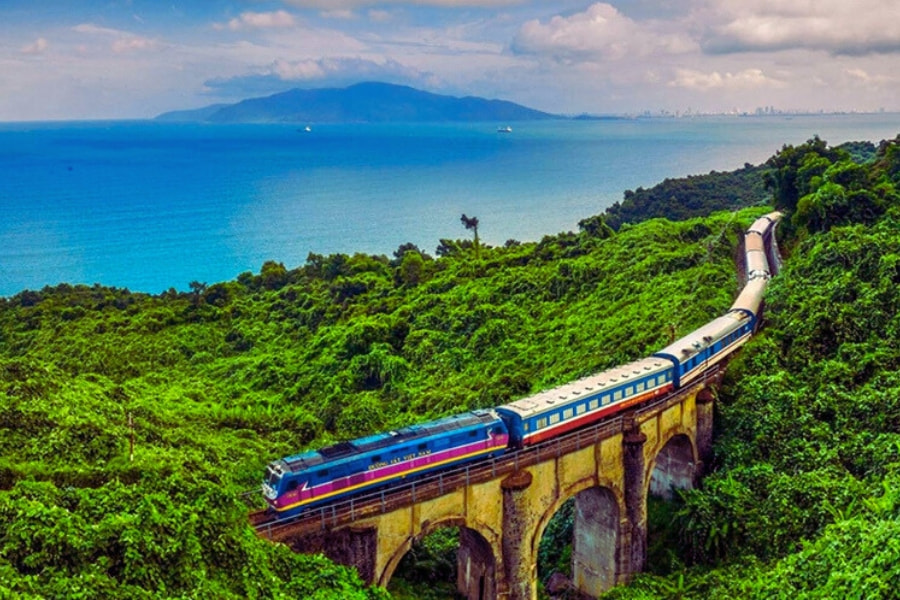 Scenic train crossing Hai Van Pass with stunning Vietnam coastline view